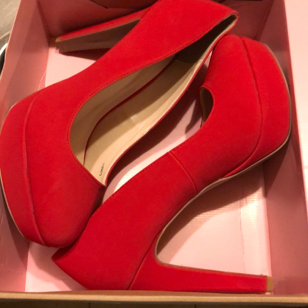 Red suede high heel shoes